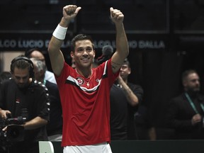 Alexis Galarneau of Laval celebrates after defeating Chile's Alejandro Tabilo during the men's single Davis Cup group A tennis match between Chile and Canada in Bologna on Saturday Sept. 16, 2023.