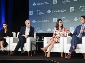 Prime Minister Justin Trudeau, right, takes part in a leaders panel discussion with, from left, Jacinda Ardern, former prime minister of New Zealand, Jonas Gahr Støre, prime minister of Norway and Sanna Marin, former prime minister of Finland, at the Global Progress Action Summit in Montreal. on Saturday, Sept. 16, 2023.