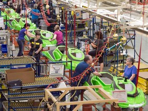 Workers on an assembly line as seen from above