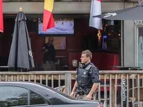 Montreal police at the scene where Angelo D'Onofrio, a man in his 70s, was shot inside the Hillside Café near the corner of Fleury and André Jobin Sts. in Montreal on Thursday, June 2, 2016.