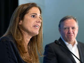 Quebec Premier Francois Legault listens to Pascale Déry after introducing her as the CAQ candidate in Repentigny, east of Montreal Tuesday July 5, 2022.