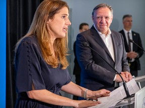 Quebec Premier Francois Legault listens to Pascale Déry after introducing her as the CAQ candidate in Repentigny, east of Montreal Tuesday July 5, 2022.