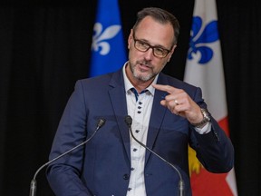 Quebec's minister of the French language, Jean-François Roberge, speaks at press conference inside Montreal city hall.