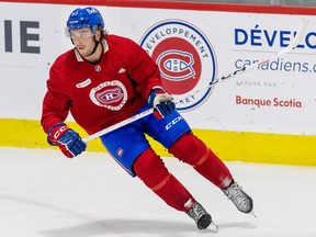 Joshua Roy, wearing a red jersey and blue hockey pants, is seen on the ice with a stick in his hand at Habs development camp this summer.