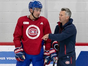 MONTREAL, QUE.: SEPTEMBER 21, 2023 -- - Montreal Canadiens coach Martin St-Louis, right, and captain Nick Suzuki during first day of training camp in Brossard on Thursday September 21, 2023. (Pierre Obendrauf / MONTREAL GAZETTE)