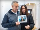 Alain Haim Look and his wife Raquel Ohnona hold a photo of their son Alexandre, one of the victims of the recent terror attacks in Israel.