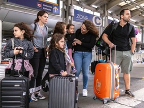 Adam Tal, his wife, Hadastan Tal, and their three daughters arrive from Israel via Athens and were met by Adam's sister, Michelle Koren, and her daughter at Trudeau airport in Dorval on Friday, Oct. 13, 2023.