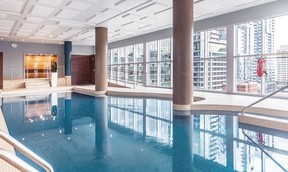 A swimming pool overlooks the Montreal skyline.
