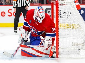 Canadiens goaltender Samuel Montembeault is seen crouching in his net as the puck i sbehind him for one of Minnesota's five goals Tuesday night at the Bell Centre.