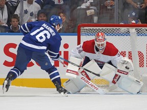 Maple Leafs' Mitch Marner is seen from behind as he fires the puck over the top left shoulder of Canadiens goalie Jake Allen on Wednesday night.