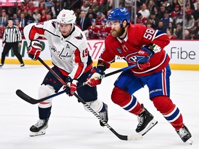 Washington Capitals' Nicklas Backstrom (19) and Canadiens' David Savard (58) skate against each other during the first period at the Bell Centre on Saturday, Oct. 21, 2023, in Montreal.
