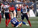 Alouettes' Reggie Stubblefield (35) celebrates an incomplete pass for Blue Bombers' Dalton Schoen during game in Winnipeg this season.