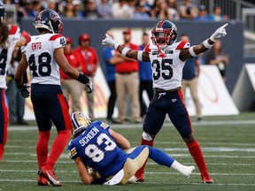 Alouettes' Reggie Stubblefield has his arms stretched out wide after an incomplete pass by the Blue Bombers this season.