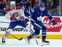 Maple Leafs' Matthew Knies and Canadiens' Tanner Pearson vie for the puck during pre-season game in Toronto this month.