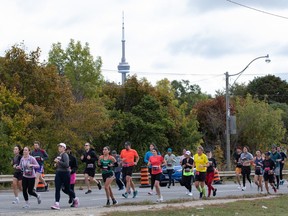 Runners participate in the Toronto Waterfront Marathon in Toronto on Sunday, Oct. 15, 2023.