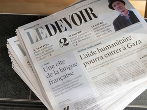 Le Devoir newspapers in a pile