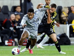 CF Montréal forward Romell Quioto, left, chases the ball in front of Columbus Crew defender Rudy Camacho during the second half of an MLS soccer match in Columbus, Ohio, on Saturday, Oct. 21, 2023.