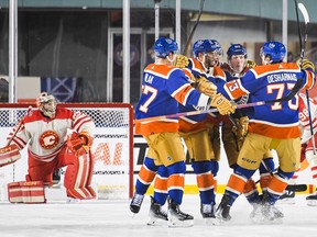 Vincent Desharnais #73 of the Edmonton Oilers celebrates scoring against goaltender Jacob Markstrom #25 of the Calgary Flames during the third period of the 2023 Tim Hortons NHL Heritage Classic at Commonwealth Stadium on October 29, 2023 in Edmonton, Alberta, Canada.