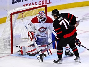 Montreal Canadiens goaltender Sam Montembeault watches the puck slide into the net as Ottawa Senators centre Ridly Greig scores.