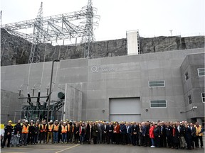 Quebec Premier François Legault, centre, poses with officials and workers at the inauguration of the La Romaine hydroelectric complex, Thursday, Oct. 12, 2023 in Havre-Saint-Pierre, Que.