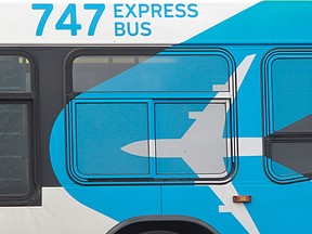 A close-up of the side of a bus with "747 Express Bus" on it
