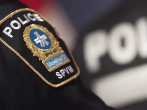 A Montreal police badge is shown during a news conference in Montreal, Monday, Oct. 7, 2019. Montreal police say they've received reports of 16 hate crimes, mostly targeting Jewish people, since the beginning of the war between Israel and Hamas on Oct. 7.
