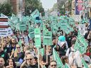 People take part in a public sector union demonstration in Montreal on Sept. 23, 2023. The Quebec government presented a contract offer on Sunday, Oct. 29, 2023, to public sector unions who are on the cusp of a strike.