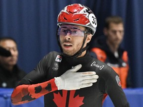 William Dandjinou of Montreal reacts after winning the 1500-metre final race at the World Cup short track speedskating event in Montreal on Saturday, Oct. 28, 2023.