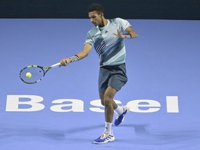 Félix Auger-Aliassime of Montreal plays Denmark's Holger Rune during their semifinal match at the Swiss Indoors tennis tournament at the St. Jakobshalle in Basel, Switzerland, on Saturday, Oct. 28, 2023.
