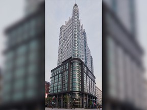 A tall glass and steel tower in Montreal.