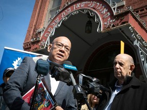 Fo Niemi, left, executive director of CRARR, and Marvin Rotrand, right, national director of B'nai Brith's League for Human Rights, speak at the front door of the Bagg St. synagogue on Tuesday April 4, 2023. Members of several racial and religious minorities of Montreal showed their support to the synagogue after it was desecrated with swastikas.