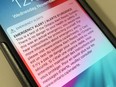 An emergency message appears on an iPhone lock screen