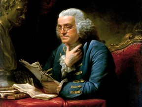 Painting of Ben Franklin reading a book at a desk