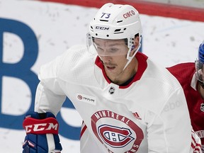 Olivier Galipeau in a Canadiens white practice jersey on the ice during training camp