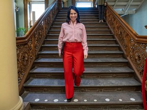 Montreal Mayor Valérie Plante descends the ornate staircase at Montreal city hall.
