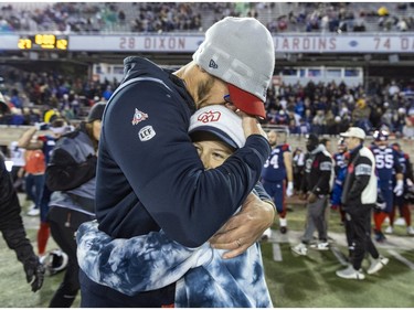 Alouettes head coach Jason Maas hugs his son Bear following Canadian Football League East Division semifinal playoff game against the Hamilton Tiger-Cats in Montreal on Saturday, Nov. 4, 2023.