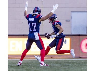 Alouettes' Cole Spieker celebrates as team-mate Austin Mack crosses the goal line for a touchdown during first half of Canadian Football League East Division semifinal playoff game against the Hamilton Tiger-Cats in Montreal on Saturday, Nov. 4, 2023.