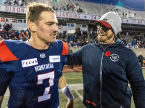 Alouettes head coach Jason Maas congratulates quarterback Cody Fajardo following their victory in the East semifinal playoff game against the Hamilton Tiger-Cats in Montreal on Nov. 4, 2023.