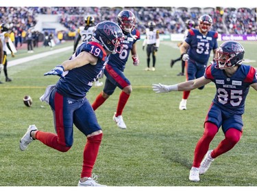 Alouettes' Jake Harty celebrates his touchdown against the Hamilton Tiger-Cats with teammate Tyler Snead, right, during second half of Canadian Football League East Division semifinal playoff game against the Hamilton Tiger-Cats in Montreal on Saturday, Nov. 4, 2023.
