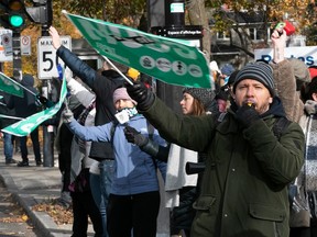 Teachers and support staff from CEGEP Maisonneuve are on the picket line on Sherbrooke St. in Montreal on Nov. 6, 2023, during a morning walkout.