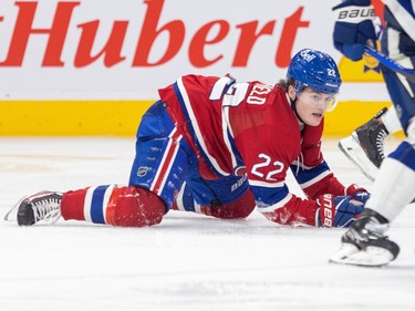 Canadiens' Cole Caufield on all fours on the ice