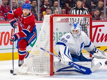Canadiens' Michael Matheson circles behind Tampa Bay Lightning goalie Matt Tomkins's net