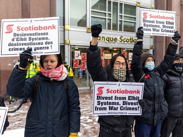 Pro-Palestinian protesters demonstrate outside the Scotiabank building on Shebrooke St. in Montreal on Thursday, Nov. 9, 2023.
