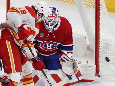 Calgary Flames' Dillon Dube (29) gets in close on Montreal Canadiens goaltender Sam Montembeault