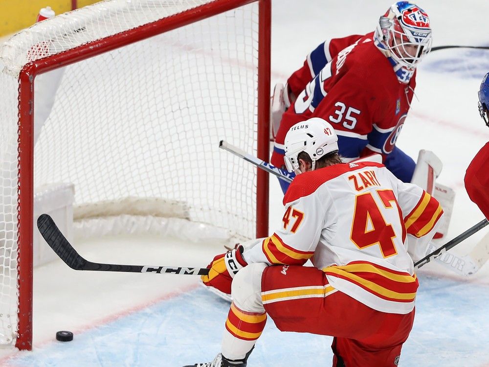 The puck lies on the goal line behind Canadiens goaltender Sam Montembeault