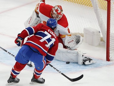 Calgary Flames goaltender Jacob Markstrom stops a shot from Montreal Canadiens' Jake Evans