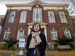Kim Phuong Nguyen stands outside an old brick building