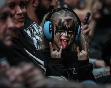 A young Kiss fan wearing ear protection waits for the show to start at the Bell Centre.