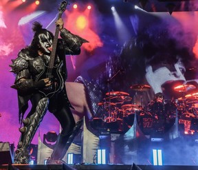 Gene Simmons of Kiss licks his bass guitar at the Bell Centre.