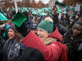A large crowd of Quebec public-sector workers rallies outside during a strike day.